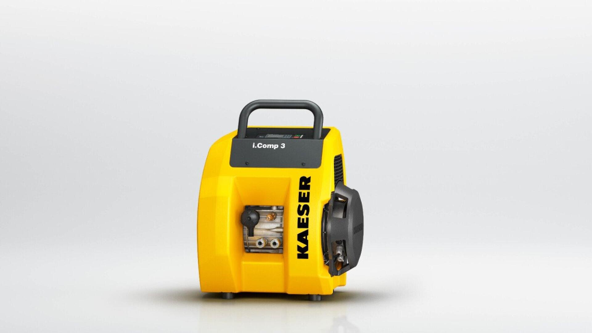 A yellow KAESER i.Comp 3 air compressor with a black handle on top, compact design, and visible internal components, set against a plain white background.
