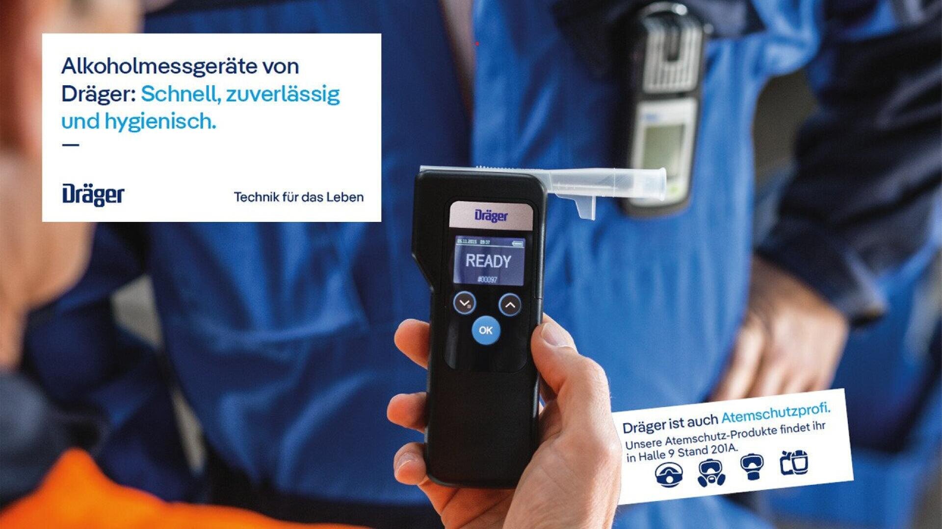 A person holds a Dräger breathalyzer device showing READY on the screen. The background shows people in blue work uniforms. Advertisements and text in German promote Dräger’s reliable and hygienic alcohol testing devices.