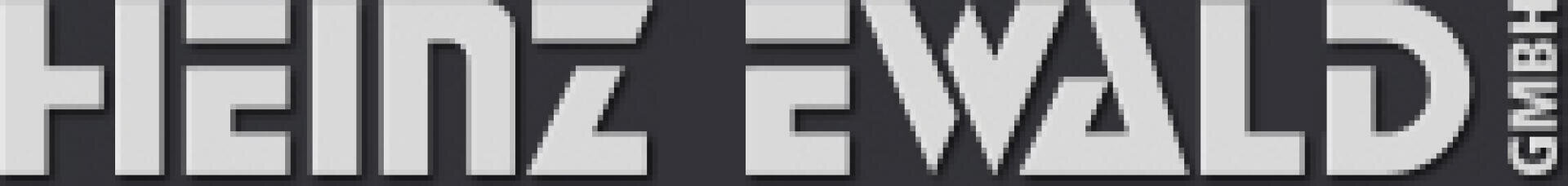 Logo mit dem Schriftzug HEINZ EWALD in fetten, geometrischen weißen Buchstaben auf dunklem Hintergrund; rechts davon steht in kleineren weißen Buchstaben senkrecht die GMBH.