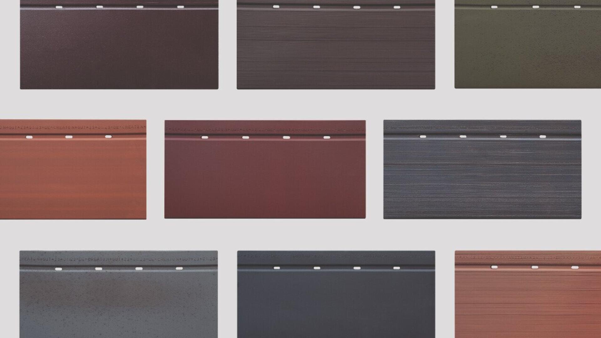 Nine rectangular metal siding samples in various colors, including shades of brown, red, gray, and green, are arranged in three rows on a white background. Each panel has small holes along the top edge.