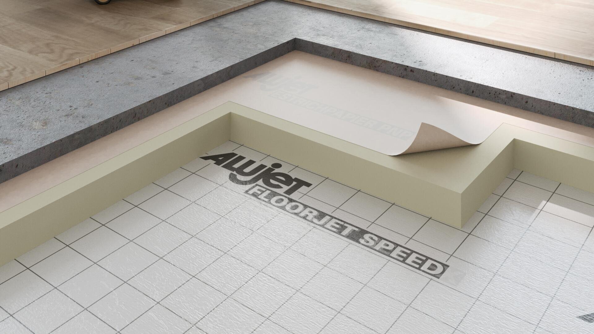 The close-up of a laminate floor shows insulation and a carpet pad with the inscription "ALUjet FLOORJET SPEED" under a partially removed film and a wood and tile covering on top.